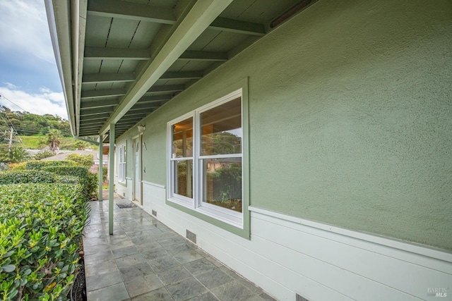 view of property exterior featuring stucco siding and crawl space