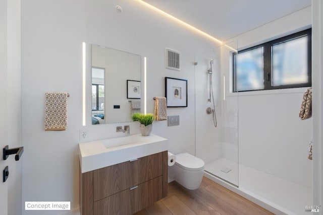 bathroom with visible vents, walk in shower, toilet, vanity, and ensuite bath