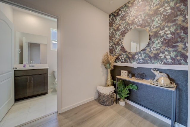 1108 Hiramatsu Ln, Winters, CA 95694 - interior space featuring a sink, baseboards, light wood-type flooring, and wallpapered walls