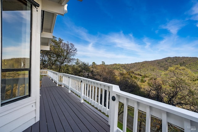 wooden deck with a mountain view