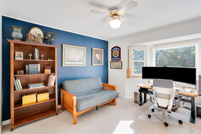 office with carpet floors, ornamental molding, baseboards, and ceiling fan