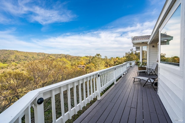 wooden deck featuring a wooded view
