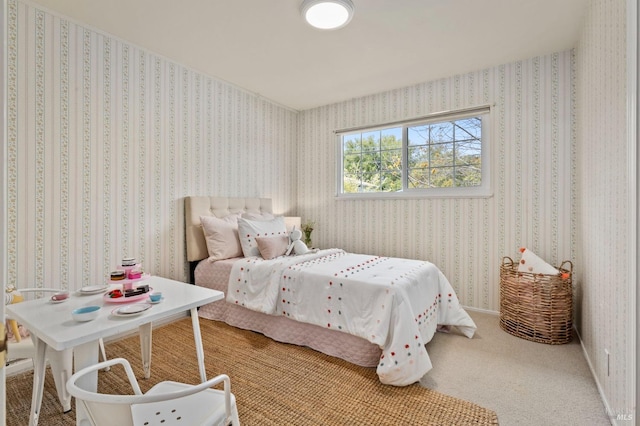 bedroom with baseboards, wallpapered walls, and carpet flooring