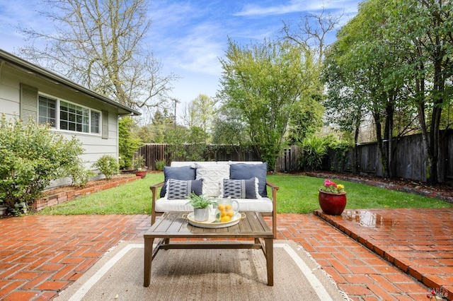 view of patio / terrace with an outdoor hangout area and a fenced backyard