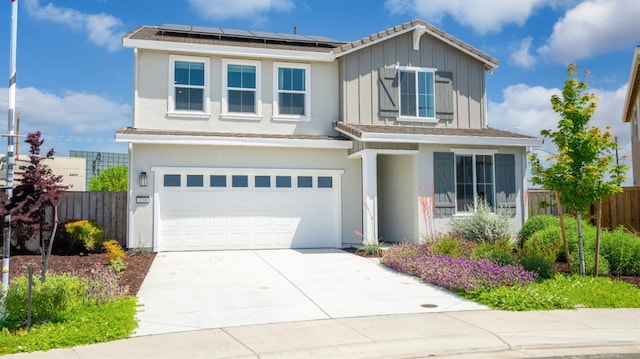1096 Fiano Pl, Manteca, CA 95337 - view of front of home with a garage, fence, solar panels, and driveway