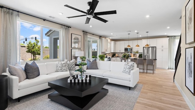1096 Fiano Pl, Manteca, CA 95337 - living area featuring light wood finished floors, recessed lighting, a ceiling fan, and baseboards