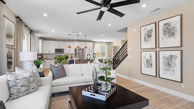 1096 Fiano Pl, Manteca, CA 95337 - living area with plenty of natural light, light wood-type flooring, recessed lighting, a ceiling fan, and baseboards