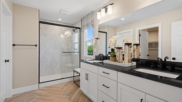1096 Fiano Pl, Manteca, CA 95337 - full bathroom with a shower stall, double vanity, recessed lighting, a spacious closet, and baseboards