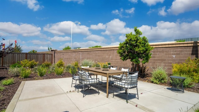 1096 Fiano Pl, Manteca, CA 95337 - view of patio / terrace with a fenced backyard and outdoor dining area