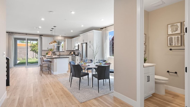 1096 Fiano Pl, Manteca, CA 95337 - dining space with light wood-style flooring, recessed lighting, and baseboards