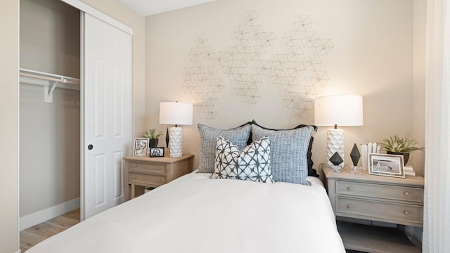 1096 Fiano Pl, Manteca, CA 95337 - bedroom featuring a closet, wood finished floors, and baseboards