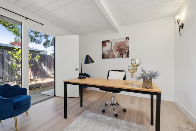 office featuring baseboards, light wood-style flooring, wooden ceiling, and beam ceiling