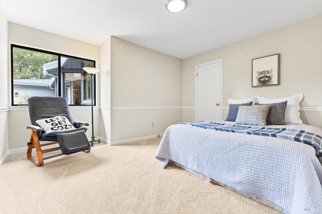 carpeted bedroom with baseboards
