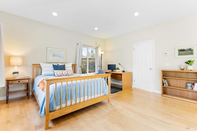 bedroom with baseboards, recessed lighting, and wood finished floors