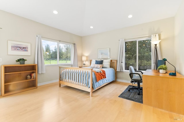 bedroom featuring recessed lighting, baseboards, and wood finished floors