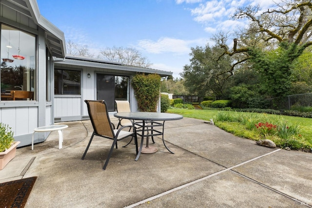 view of patio / terrace featuring outdoor dining area and fence