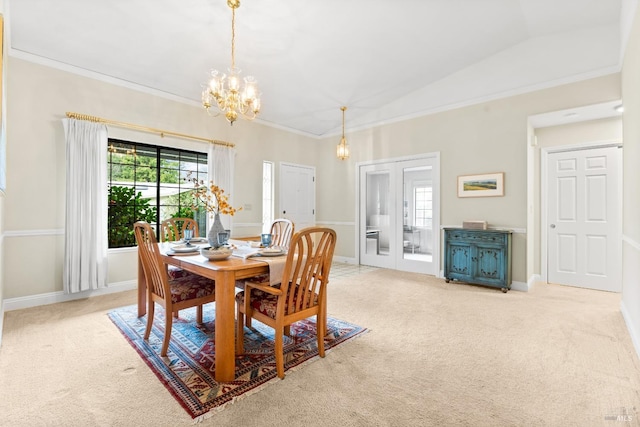 dining space featuring carpet flooring, crown molding, and a notable chandelier