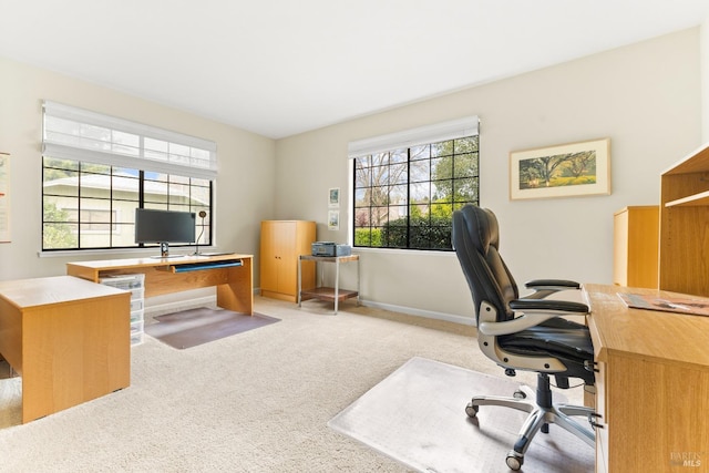 home office with baseboards and carpet