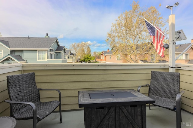 view of patio / terrace with a residential view and a balcony