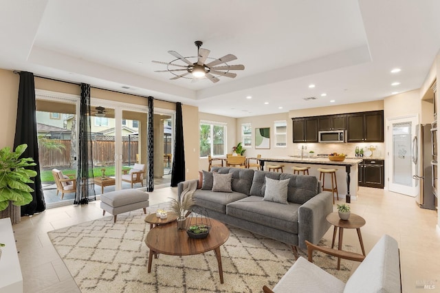 8568 Pinehollow Cir, Discovery Bay, CA 94505 - living room with a raised ceiling, a ceiling fan, recessed lighting, and light tile patterned floors