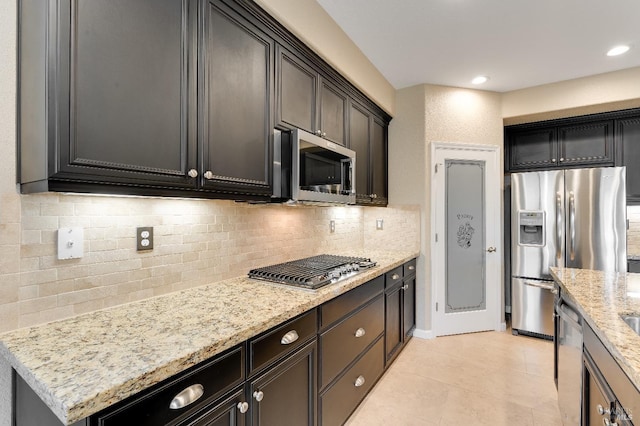 8568 Pinehollow Cir, Discovery Bay, CA 94505 - kitchen with appliances with stainless steel finishes, light stone counters, decorative backsplash, light tile patterned floors, and recessed lighting