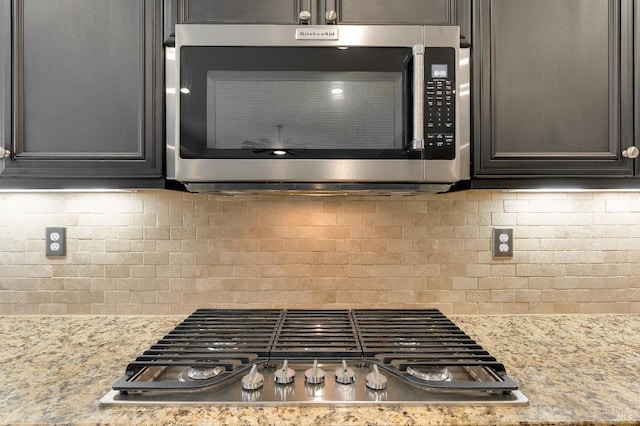 8568 Pinehollow Cir, Discovery Bay, CA 94505 - kitchen view of stainless steel appliances, backsplash, and light stone countertops