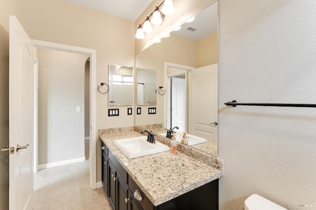8568 Pinehollow Cir, Discovery Bay, CA 94505 - bathroom featuring vanity, tile patterned flooring, toilet, baseboards, and a textured wall