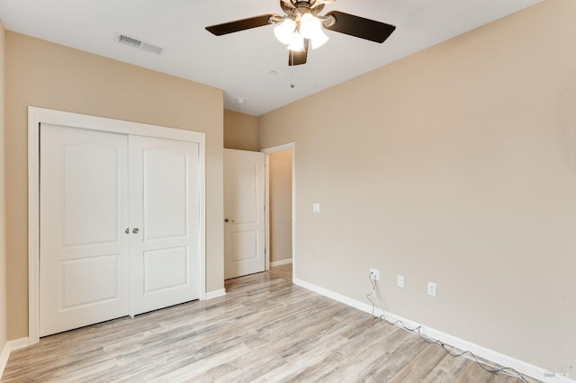 8568 Pinehollow Cir, Discovery Bay, CA 94505 - unfurnished bedroom featuring light wood-style flooring, a closet, baseboards, and a ceiling fan