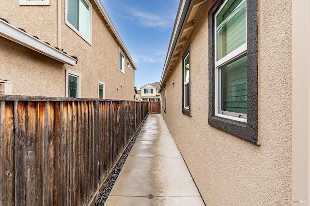 8568 Pinehollow Cir, Discovery Bay, CA 94505 - view of property exterior featuring stucco siding and fence