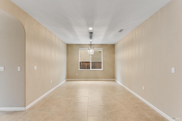 8568 Pinehollow Cir, Discovery Bay, CA 94505 - unfurnished room with arched walkways, light tile patterned floors, and baseboards