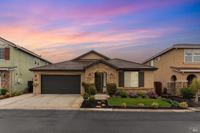 8568 Pinehollow Cir, Discovery Bay, CA 94505 - view of front facade featuring a tiled roof, stone siding, driveway, an attached garage, and stucco siding