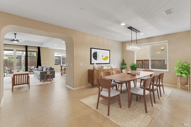 8568 Pinehollow Cir, Discovery Bay, CA 94505 - dining area with arched walkways, a ceiling fan, baseboards, recessed lighting, and light tile patterned floors
