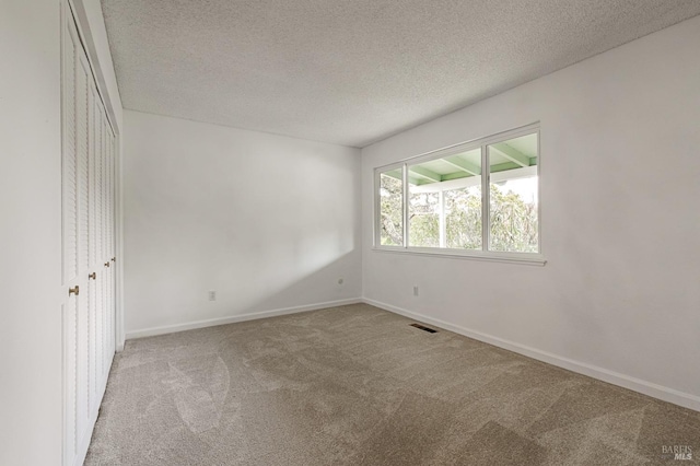 6574 Stone Bridge Rd, Santa Rosa, CA 95409 - unfurnished room with carpet floors, baseboards, visible vents, and a textured ceiling