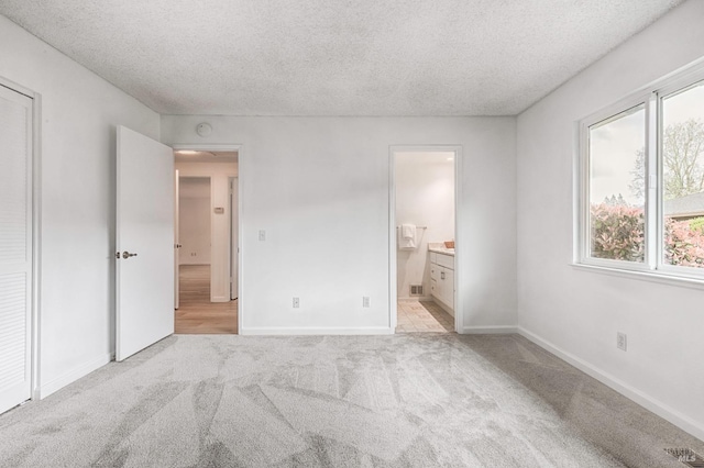 6574 Stone Bridge Rd, Santa Rosa, CA 95409 - unfurnished bedroom featuring carpet flooring, a textured ceiling, visible vents, baseboards, and ensuite bath