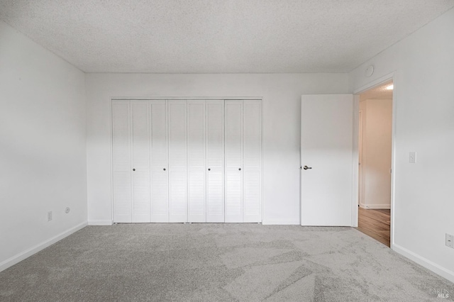 6574 Stone Bridge Rd, Santa Rosa, CA 95409 - unfurnished bedroom featuring carpet, a closet, and a textured ceiling