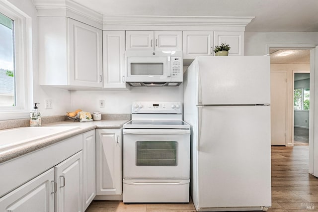 6574 Stone Bridge Rd, Santa Rosa, CA 95409 - kitchen featuring white cabinetry, light countertops, light wood-style floors, and white appliances