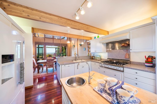 kitchen featuring stainless steel gas stovetop, beamed ceiling, a sink, ventilation hood, and fridge with ice dispenser