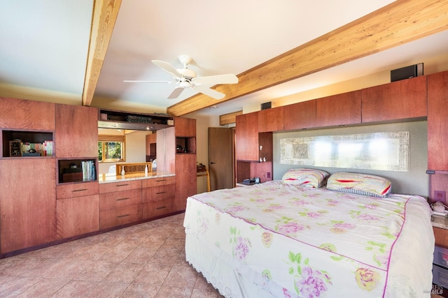 bedroom with light tile patterned floors and beam ceiling