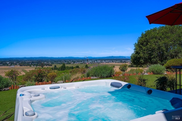 view of pool featuring a hot tub