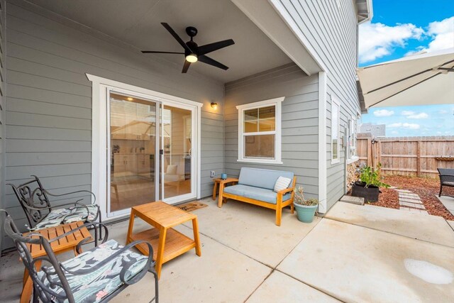 view of patio / terrace featuring ceiling fan and fence