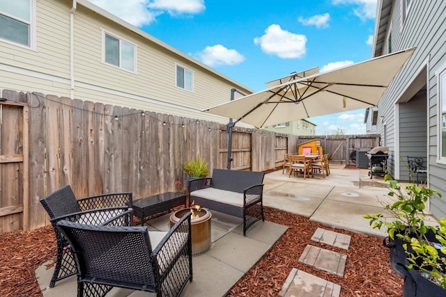 view of patio / terrace featuring a fenced backyard, outdoor dining space, and an outdoor living space
