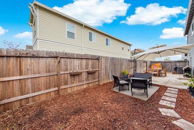 view of yard featuring a fenced backyard and a patio area