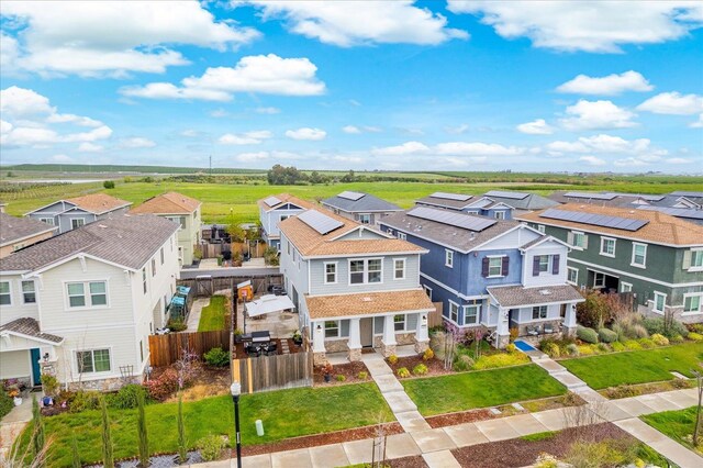 exterior space featuring a residential view, a fenced backyard, and a front yard
