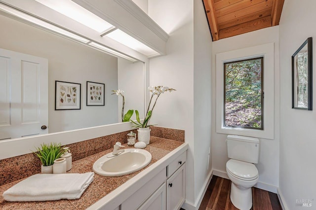 70 Black Log Rd, Kentfield, CA 94904 - half bath with vanity, wood finished floors, toilet, baseboards, and lofted ceiling