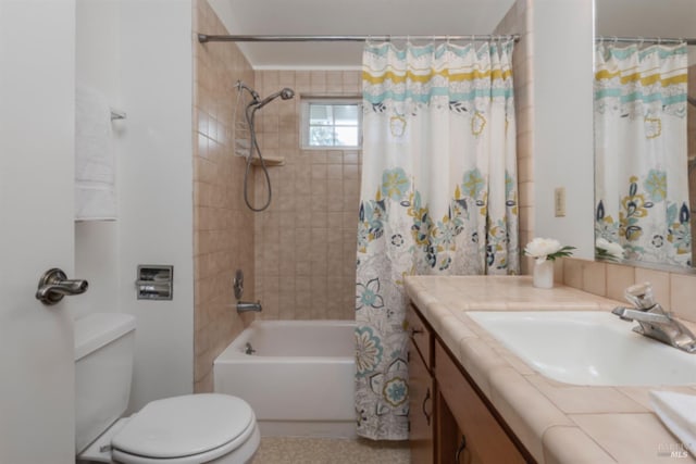 bathroom with toilet, vanity, and shower / bath combo