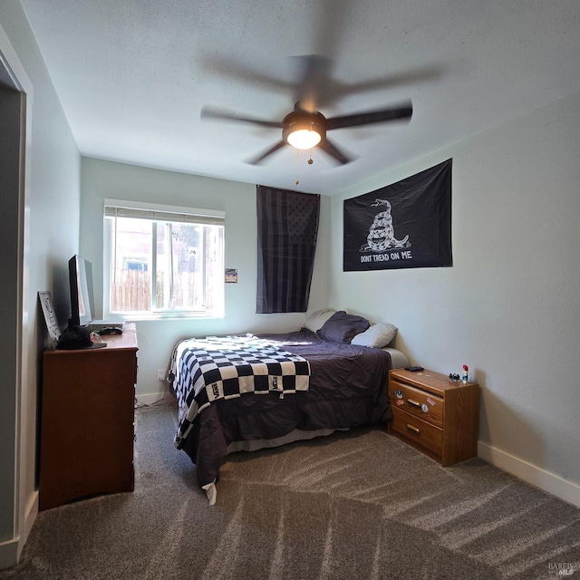 bedroom featuring baseboards, ceiling fan, and carpet