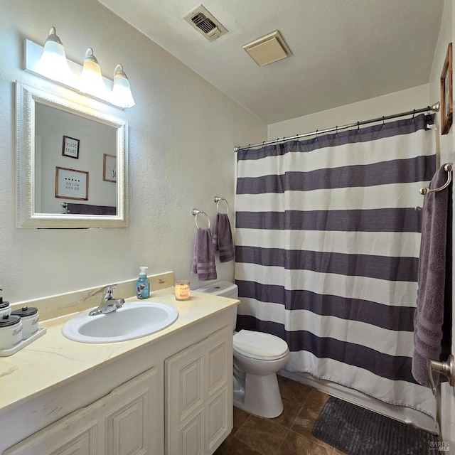 bathroom with visible vents, toilet, tile patterned floors, curtained shower, and vanity