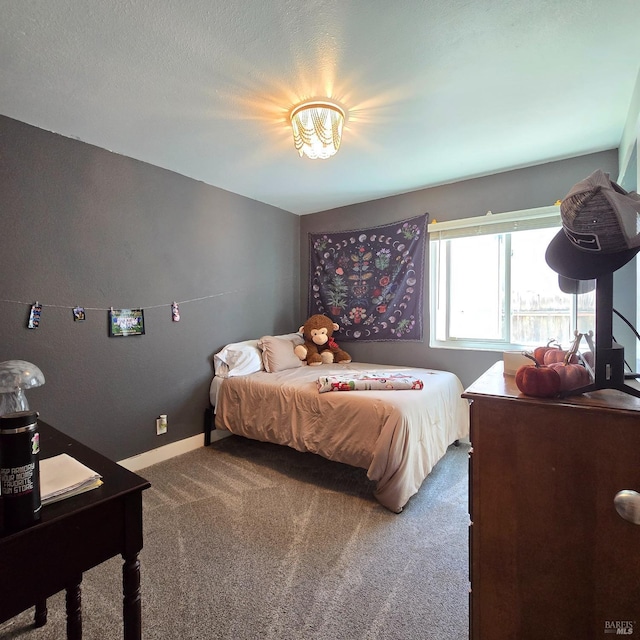 bedroom featuring carpet floors and baseboards