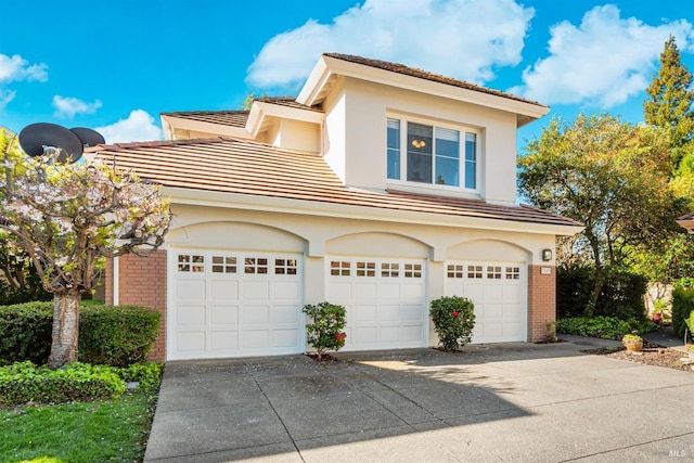 2909 Quail Hollow Dr, Fairfield, CA 94534 - view of front facade featuring concrete driveway, brick siding, a tile roof, and stucco siding