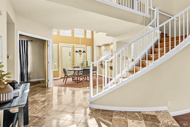 2909 Quail Hollow Dr, Fairfield, CA 94534 - entryway featuring baseboards, stairway, an inviting chandelier, and a high ceiling